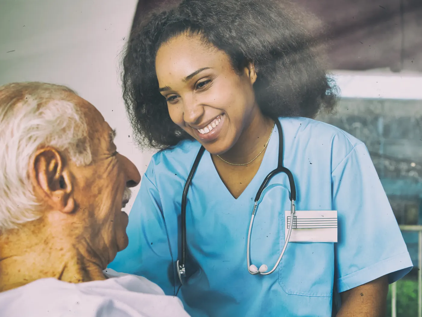 Certified nursing assistant caring for a patient