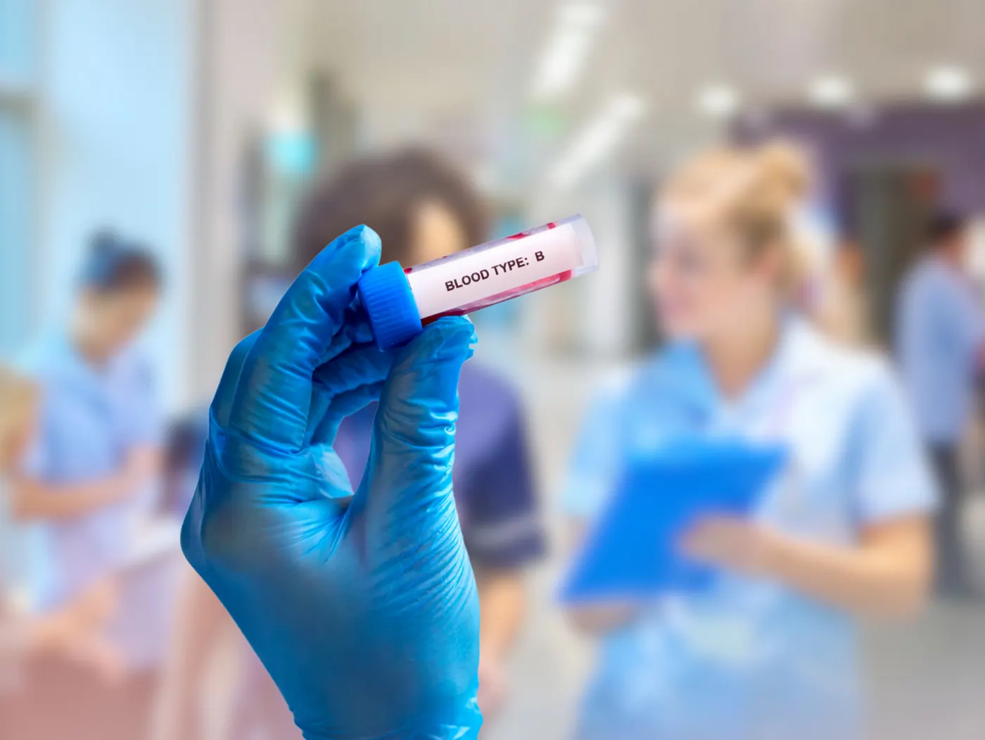 Phlebotomist drawing a blood sample from a patient
