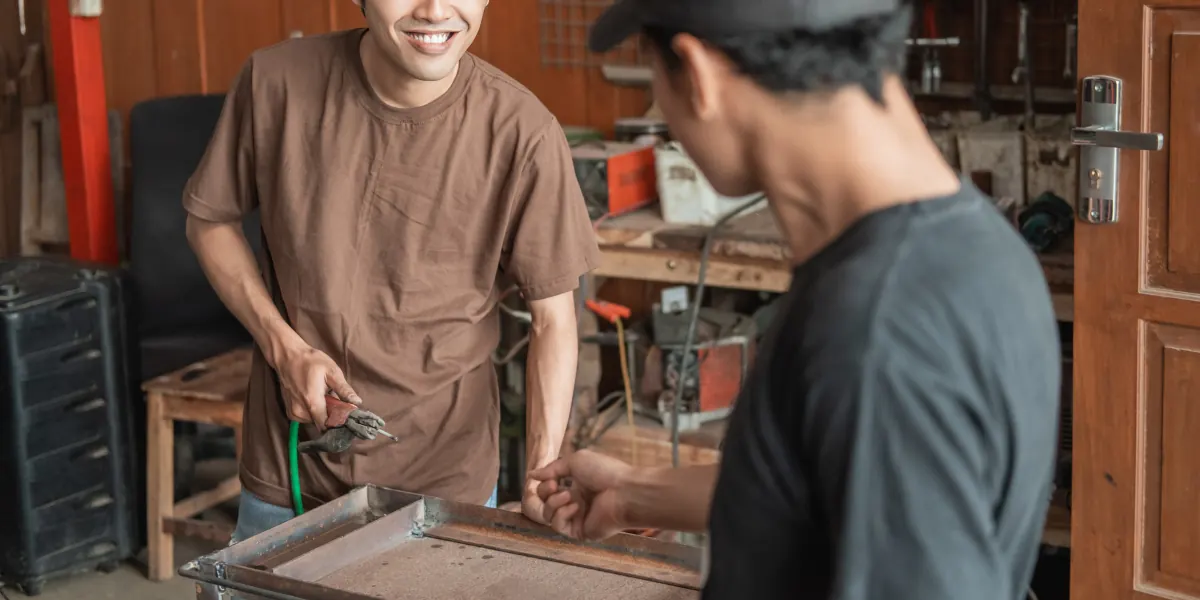 Welding student working on a weld in a training shop