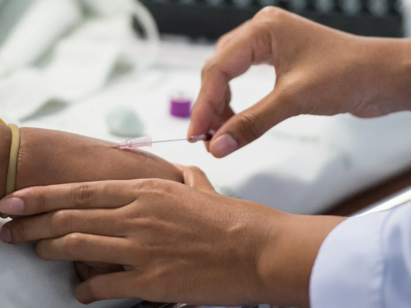 Phlebotomy student drawing a blood sample