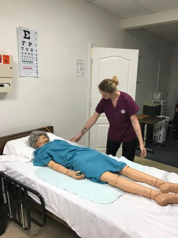 Nursing assistant students practicing patient care skills