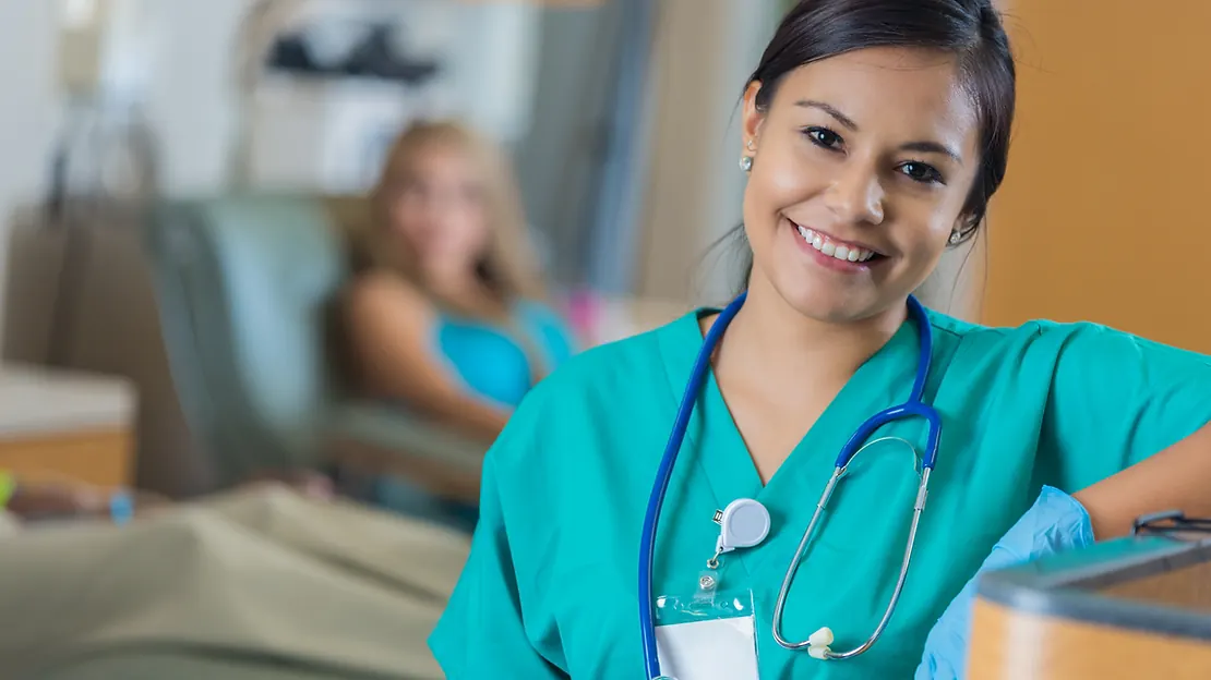 Phlebotomy student studying certification requirements