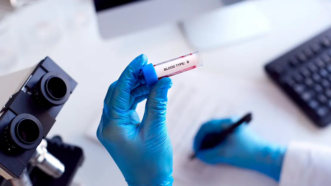 Phlebotomist collecting a blood sample from a patient