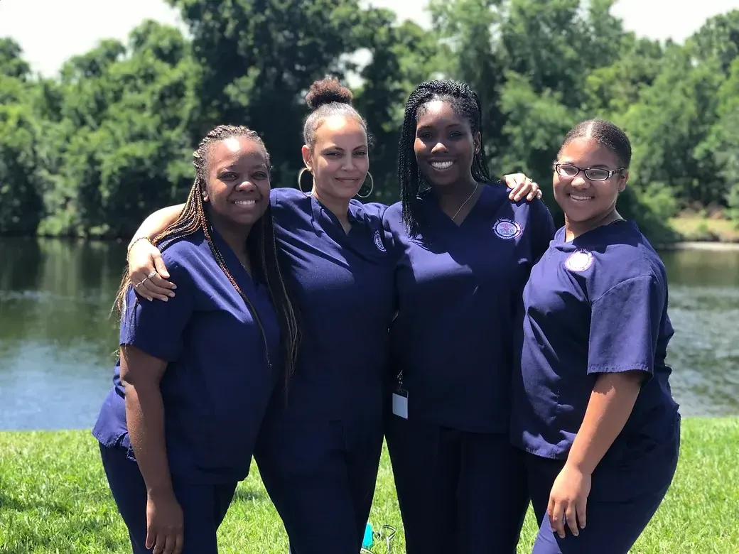 Nursing assistant graduates celebrating completion of their CNA program